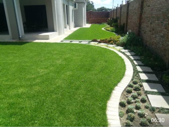 Lawn supply and installation with paved stepping edge